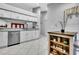 Bright kitchen features an island, stainless steel appliances, and white cabinets at 4017 103Rd N Ave, Clearwater, FL 33762