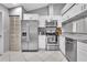 Recently renovated kitchen with white cabinets, stainless appliances, and updated countertops at 4017 103Rd N Ave, Clearwater, FL 33762