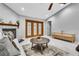 A living room featuring fireplace, doors to outside, and adjacent TV console at 4017 103Rd N Ave, Clearwater, FL 33762