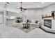 Spacious living room featuring a fireplace and ample seating at 4017 103Rd N Ave, Clearwater, FL 33762