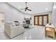 Spacious living room with fireplace and double doors to outdoor living area at 4017 103Rd N Ave, Clearwater, FL 33762