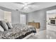 Spacious main bedroom featuring tile floors, a ceiling fan, and a walk-in closet at 4017 103Rd N Ave, Clearwater, FL 33762