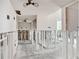 Bright living room featuring ceiling fans and stud framing with insulation at 404 Moorings Cove Dr # 404, Tarpon Springs, FL 34689