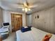 Bedroom featuring closet and a ceiling fan, and ample storage space at 4105 Wedgemere Dr, Tampa, FL 33610