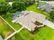 An aerial view of the home and a portion of the lush green lawn with trimmed landscaping at 4615 Cozzo Dr, Land O Lakes, FL 34639
