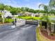Branch Ranch Estates gated community entrance with lush landscaping and a view of the homes at 4615 Cozzo Dr, Land O Lakes, FL 34639