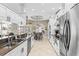 Spacious kitchen with stainless steel appliances, granite counters, and an open layout for easy entertaining at 4615 Cozzo Dr, Land O Lakes, FL 34639