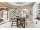 Eat-in kitchen boasts sliding glass doors to the pool area and bar top seating at 4615 Cozzo Dr, Land O Lakes, FL 34639