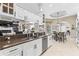 Gourmet kitchen featuring granite countertops, stainless steel appliances and open access to dining area at 4615 Cozzo Dr, Land O Lakes, FL 34639
