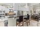 Modern kitchen features granite countertops, stainless steel appliances, and breakfast bar seating at 4615 Cozzo Dr, Land O Lakes, FL 34639