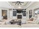 Beautiful living room with a fireplace, built-in shelving, and a sliding glass door leading to the backyard at 4615 Cozzo Dr, Land O Lakes, FL 34639