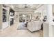 Open living area with tile flooring, a fireplace, and sliding doors leading to the pool at 4615 Cozzo Dr, Land O Lakes, FL 34639
