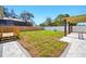 Expansive backyard featuring a deck and a patio with a charming pergola, perfect for outdoor entertaining and relaxation at 5030 9Th S Ave, Gulfport, FL 33707