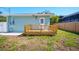 Backyard featuring a wooden deck with a white back door at 5030 9Th S Ave, Gulfport, FL 33707