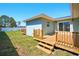 Backyard featuring a wooden deck and glass sliding doors at 5030 9Th S Ave, Gulfport, FL 33707