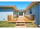 Backyard featuring a wooden deck and glass sliding doors at 5030 9Th S Ave, Gulfport, FL 33707