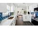 Bright kitchen featuring modern appliances, white countertops, and a view of the living room for an open feel at 5030 9Th S Ave, Gulfport, FL 33707