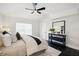 Comfortable bedroom with a ceiling fan, large window, and stylish decor for a serene retreat at 5030 9Th S Ave, Gulfport, FL 33707