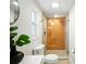 Modern bathroom features glass-enclosed shower, updated fixtures, and natural light at 5647 110Th Way, Seminole, FL 33772