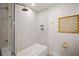 Contemporary bathroom with a shower, tub, and woven art adding unique texture at 5647 110Th Way, Seminole, FL 33772
