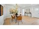 Dining room with modern lighting, dining table with 4 chairs, and unique wall decorations at 5647 110Th Way, Seminole, FL 33772