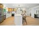 Spacious kitchen featuring stainless steel appliances, stylish island with seating, and wood cabinets at 5647 110Th Way, Seminole, FL 33772
