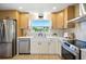 Modern kitchen features stainless appliances, stone countertops, and bright natural lighting at 5647 110Th Way, Seminole, FL 33772