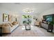 Comfortable living room featuring sliding glass doors to the back yard, neutral paint, and modern furniture at 5647 110Th Way, Seminole, FL 33772