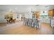 Open living space featuring modern kitchen with island seating, dining area, and modern decor at 5647 110Th Way, Seminole, FL 33772