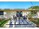 Inviting outdoor patio with modern seating, perfect for relaxing and enjoying the backyard at 5647 110Th Way, Seminole, FL 33772