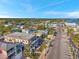 Nice aerial view of homes close to a beach, pier, and lush surroundings under a bright blue sky at 5659-5657 Shore S Blvd, Gulfport, FL 33707