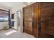 Bathroom featuring a large wooden cabinet and a shower with decorative tile detail at 5659-5657 Shore S Blvd, Gulfport, FL 33707