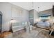 Modern bedroom featuring gray walls, contemporary art and cozy seating at 5659-5657 Shore S Blvd, Gulfport, FL 33707