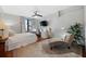 Bedroom features large window, workspace, and chaise lounge, offering comfort and functionality at 5659-5657 Shore S Blvd, Gulfport, FL 33707