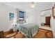 Cozy bedroom with seaside decor, plush bedding, and mirrored closet doors at 5659-5657 Shore S Blvd, Gulfport, FL 33707
