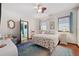 Bedroom featuring a sitting area, en suite bathroom and wood floors at 5659-5657 Shore S Blvd, Gulfport, FL 33707