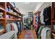 Spacious walk-in closet with ample shelving and hanging storage for organization at 5659-5657 Shore S Blvd, Gulfport, FL 33707