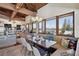 Dining area with scenic views, built in bench seating and wood beam ceilings at 5659-5657 Shore S Blvd, Gulfport, FL 33707