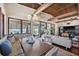 Spacious dining area open to living room with beach views, wood ceilings and stylish decor at 5659-5657 Shore S Blvd, Gulfport, FL 33707