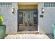 Stylish gated entry with modern design, complemented by well-lit surroundings and elegant curb appeal at 5659-5657 Shore S Blvd, Gulfport, FL 33707