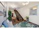 Elegant foyer with staircase, showcasing stylish decor and ample natural light at 5659-5657 Shore S Blvd, Gulfport, FL 33707