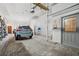 Spacious garage with ample storage and parking, features a blue Subaru at 5659-5657 Shore S Blvd, Gulfport, FL 33707