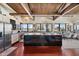 Bright kitchen boasts a large island, stainless appliances, and wood ceiling beams at 5659-5657 Shore S Blvd, Gulfport, FL 33707
