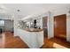 Open-concept kitchen with wood counters, bar seating, and hardwood floors at 5659-5657 Shore S Blvd, Gulfport, FL 33707