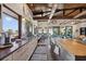 Open kitchen area with a long granite countertop, farm sink, and views of the ocean at 5659-5657 Shore S Blvd, Gulfport, FL 33707