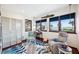 Bright living room with water views, accent rug, comfortable furniture, and nautical décor at 5659-5657 Shore S Blvd, Gulfport, FL 33707