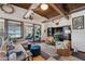Spacious living room featuring beach views, coffered ceilings, and stylish decor at 5659-5657 Shore S Blvd, Gulfport, FL 33707