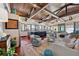 Open concept living room area with ocean views, wood floors and exposed beams at 5659-5657 Shore S Blvd, Gulfport, FL 33707