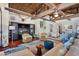 Cozy living room area with unique decor, wood ceilings, and lots of natural light at 5659-5657 Shore S Blvd, Gulfport, FL 33707