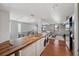 Bright kitchen with light-filled living room, hardwood floors and modern finishes at 5659-5657 Shore S Blvd, Gulfport, FL 33707